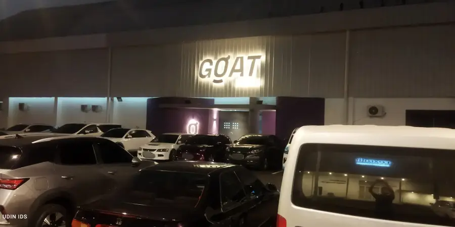 GOAT sign lit at night