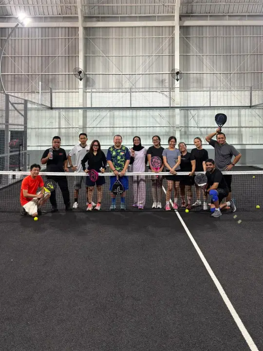 Players posing at the net